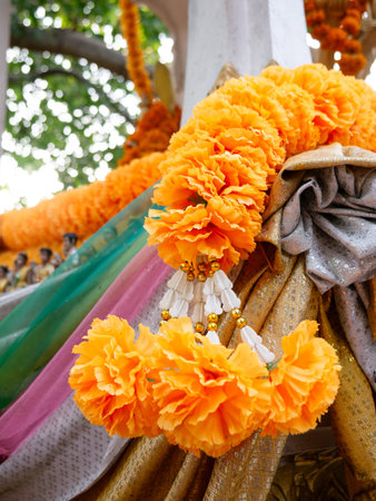 Vibrant Orange Marigold Flower Garlands at Hindu Buddhist Temple Shrine - Traditional Religious Offering Close-Upの写真素材