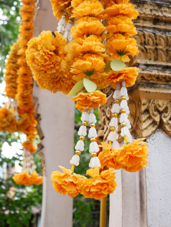 Vibrant Orange Marigold Flower Garlands at Hindu Buddhist Temple Shrine - Traditional Religious Offering Close-Upの写真素材