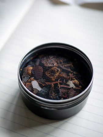Dried Herbs and Natural Aromatics in Metal Tin Traditional Thai Herbal Inhalant Medicine Ingredientsの写真素材