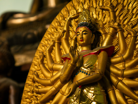 Golden Thousand-Armed Avalokitesvara Bodhisattva Statue Buddhist Deity Guan Yin Compassion Symbolの写真素材