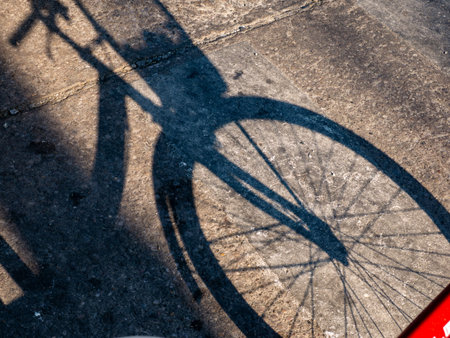 Bicycle Shadow Cast on Concrete Ground in Afternoonの写真素材