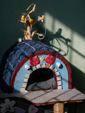 Handmade Colorful Cat House with Decorative Details and Toysの写真素材