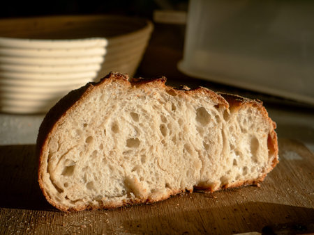 Artisan Bread Slice Close-up Showing Airy Crumb Texture on Wooden Board