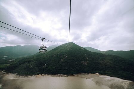 Cableway passing in front of Hong Kong islandの写真素材