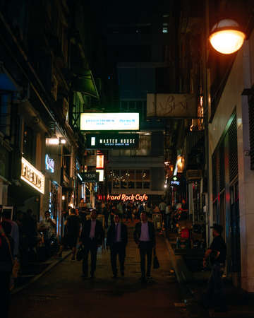 Hong Kong, China; Dic 3 2017: Busy street at night with people, cars and neon lights
