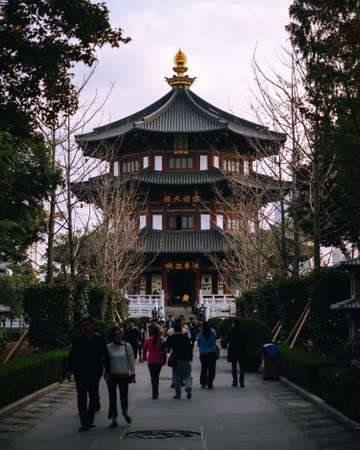 Suzhou, China; Nov 29 2017: Chinese ancient temple with people walking in the parkのeditorial素材