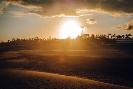 Maspalomas, Canary Islands. Desert dunes at sunset with very orange tonesの写真素材
