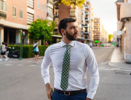 Young business man with white shirt and tie in outdoor cityの写真素材