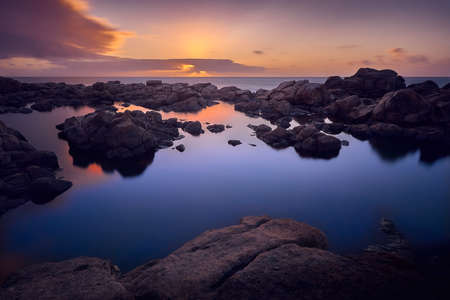 Calm sea water with sunsetの写真素材