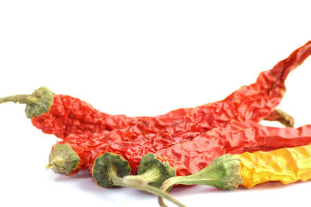 arrangement of different colored chilli peppersの写真素材