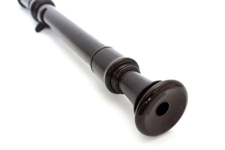 plastic dark  blockflute over white backgroundの写真素材