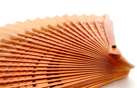 opened  fan made of rosewood over white backgroundの写真素材