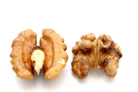 two facets of walnut kernel over white backgroundの写真素材