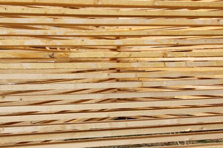 abstract pattern - planks left to dry near a sawmillの写真素材