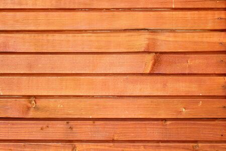brown wooden texture on the facade  of a lodgeの写真素材
