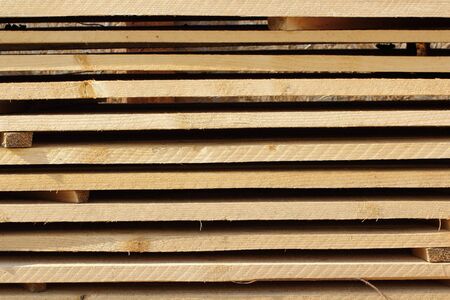 planks left to dry forming an interesting patternの写真素材