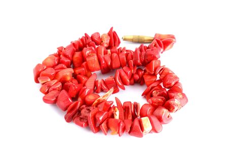 red coral beads over white backgroundの写真素材
