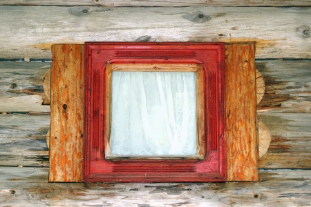 exterior view of a small wooden window on the facade of a lodgeの写真素材