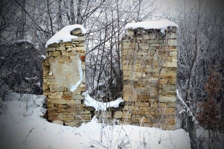 ruins of an old abandoned  house - winter sceneの写真素材