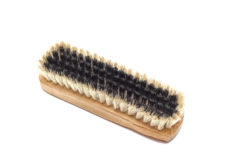 used old wooden shoe brush isolated over white backgroundの写真素材