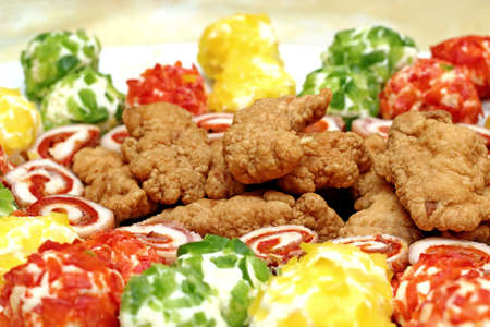 pork schnitzel and cheese balls decorated with pieces of pepperの写真素材