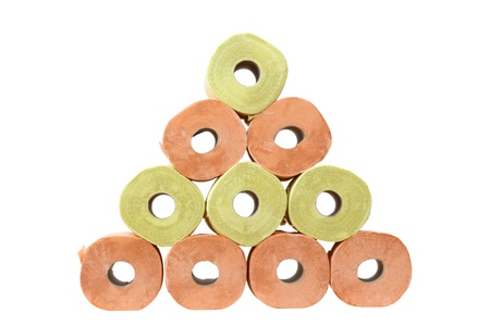 pyramid of toilet paper isolated over white backgroundの写真素材