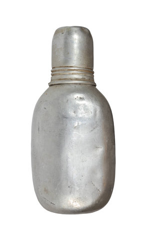 old used aluminium flask isolated over white background, traditional item for outdoor pursuitsの写真素材