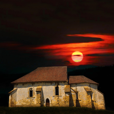 haunted old church at sunset, abandoned damaged buildingの写真素材
