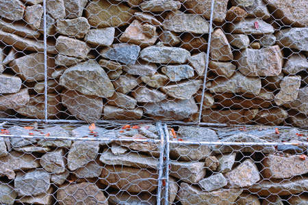 support stone wall in metallic net,  texture for your designの写真素材