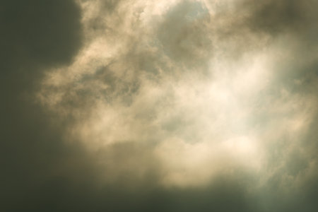 moody sky background of dark clouds before a thunder-storm