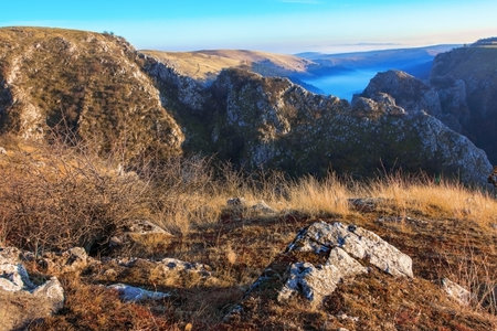 fog over limestone gorge in Transylvania, Cheile Turenilor in late autumnの写真素材