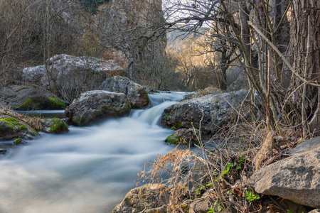 beautiful wild water stream flowing through the rocks in Apuseni mountains
