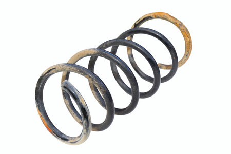 damaged rusty old car spring isolated over white background, object ready for your designの写真素材