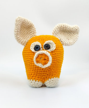 Knitted wool pig, soft toy pig, funny little pig, orange pig,の写真素材