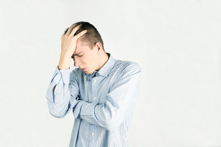 Frustrated office employee isolated in white background, men in shirtの写真素材