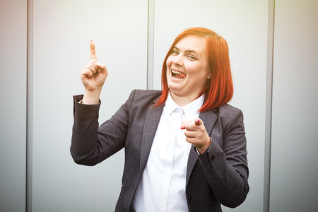 Business concept of success. Serious Successful Woman chef, in a suit emotionally celebrates the achievement. With a place for advertising text. Chef Day, Boss Dayの写真素材