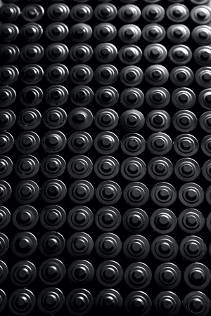 Ecology recycling concept, nature energy, many used or new battery piramide, rechargeable AA accumulator, alkaline batteries in row top view with white side glow, technology backgroundの写真素材