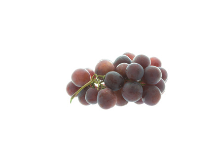 red grapes isolated on whiteの写真素材