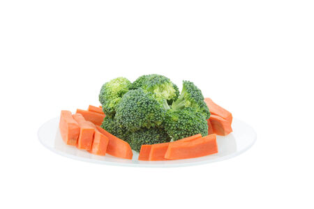 fresh broccoli and caeeot isolated on whiteの写真素材