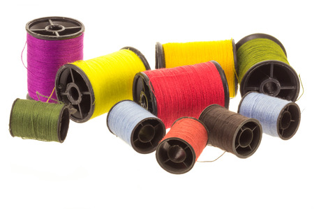 thread spools on white background