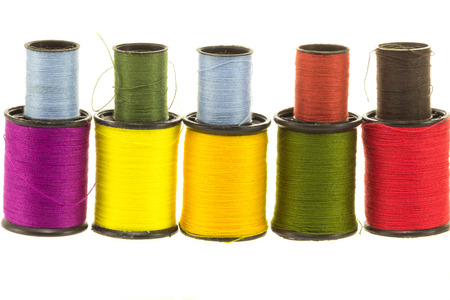 Thread spools on white background