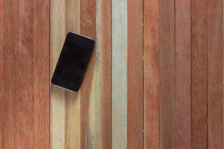 Smartphone on wood backgroundの写真素材
