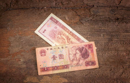 chinese currency on wood background