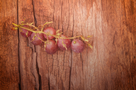 Portion of fresh grapes on woodの写真素材