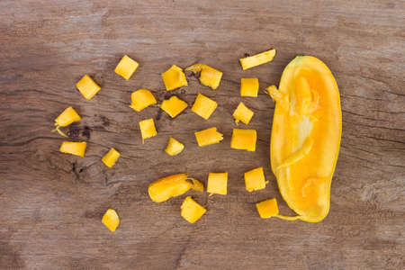 yellow mango on wood backgroundの写真素材