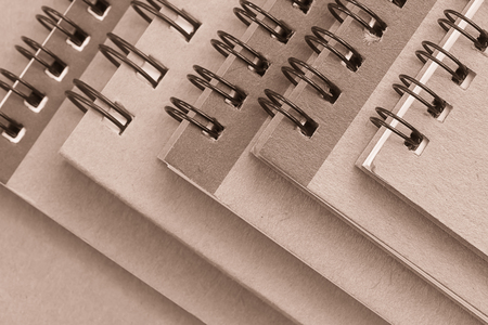 stack of spiral brown notebookの写真素材