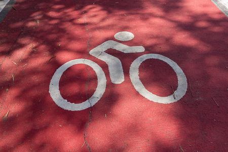 a road with dedicated bicycle laneの写真素材