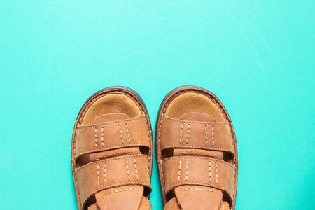 Brown shoes on blue backgroundの写真素材