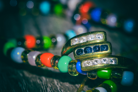 Closeup of diamond ring on woodの写真素材