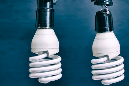 Light bulb isolated on blue background